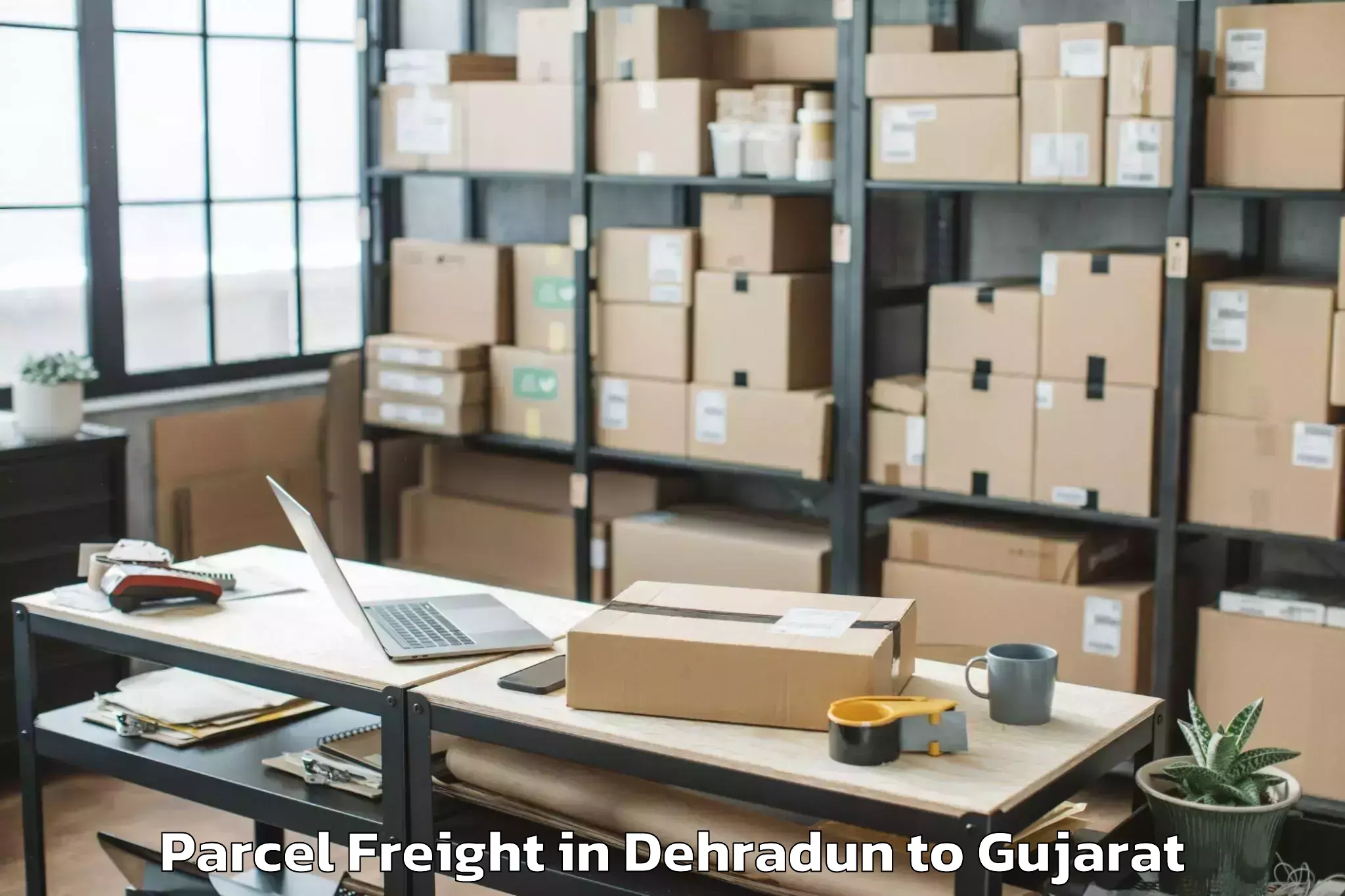 Top Dehradun to Jamkandorna Parcel Freight Available